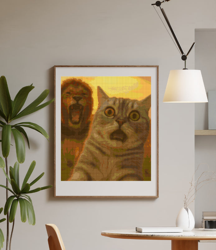 A hilarious diamond painting kit displayed in a cozy modern room, showing a wide-eyed cat snapping a selfie as a lion roars in the background—perfect wall art for animal lovers and humor fans.