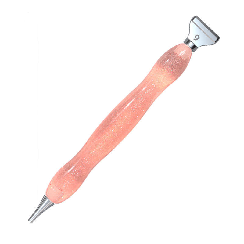 Pink ergonomic resin pen with single and 9-placer tips for diamond painting, ideal for precision work and reducing hand fatigue.