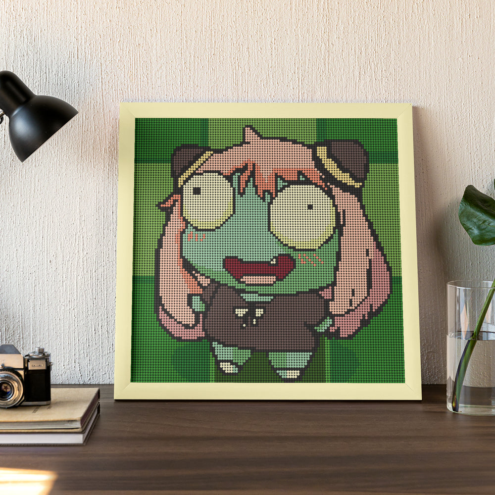 Framed Silly Zombie Girl diamond painting displayed on a wall in a cozy home setting, showcasing a playful Halloween-themed decor idea.
