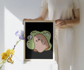 Framed mini cute Sad Ghost diamond painting, displayed as wall art. Pastel green-beige tones, 20x30cm, 2,030 round drills, 8 colors plus 1 AB or Fairy Dust drill. Gentle and expressive decoration or thoughtful gift.