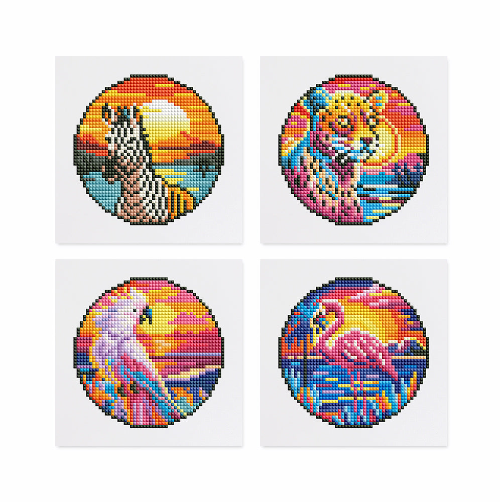 Completed set of 4 mini wild animal diamond painting kits, featuring a zebra, tiger, parrot, and flamingo, each 10x15cm, showcasing vibrant and unique designs.