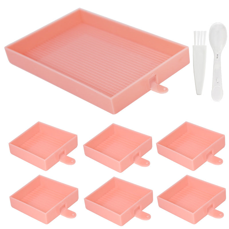 Pink rectangular diamond painting tray set with 1 large tray, 6 small trays, a spoon, and a brush – for organized DIY crafting.