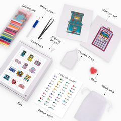 Close-up of Mini Kits canvas set showing arcade and slot machine designs, with diamond painting tools and accessories.