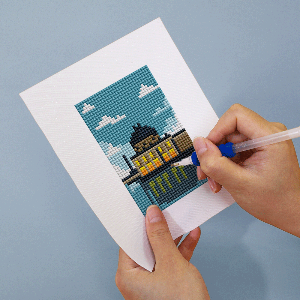 Close-up of hands crafting Berlin’s Museum Island diamond painting on soft canvas; ideal for beginners seeking relaxing and cultural creative escape.