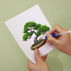 Close-up of bonsai Podocarpus plant diamond painting – high-resolution printed canvas with delicate drill placement.
