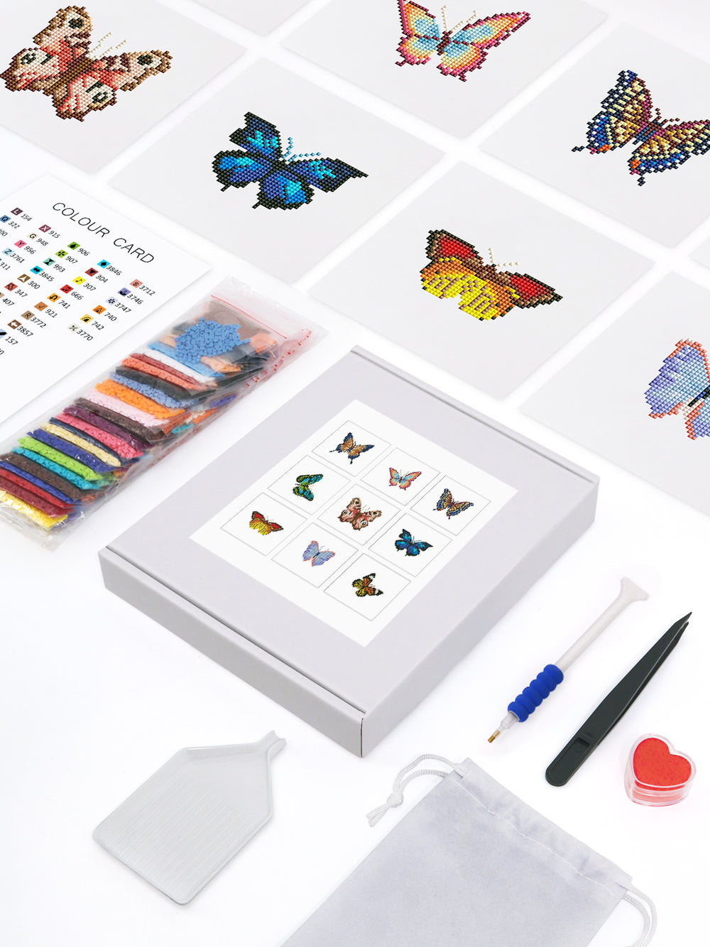 Complete butterfly mini diamond painting kit with colorful drills, pen tool, tweezers, wax, color card, and boxed 9 butterfly canvases – perfect DIY gift for beginners.