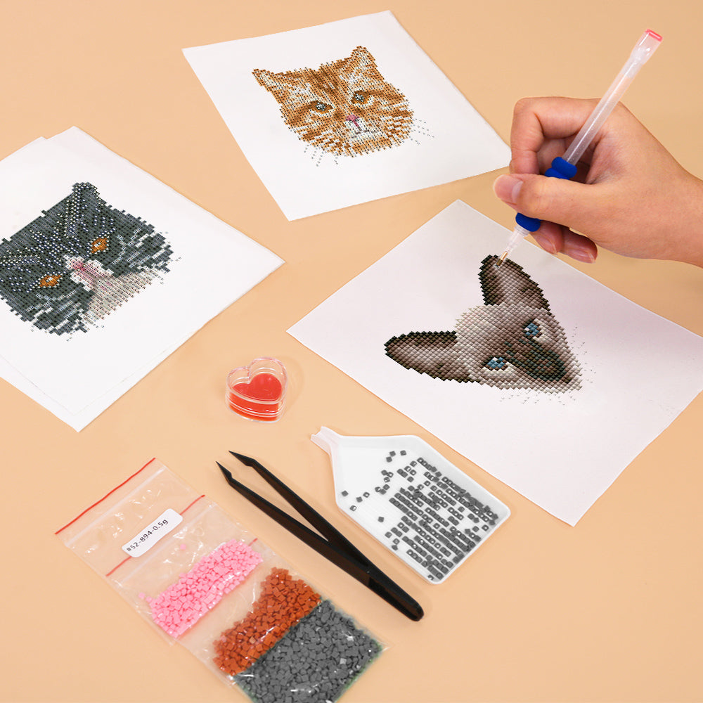 Hands applying drills to cute cat diamond painting canvas – fun and beginner-friendly DIY art kit for cat lovers