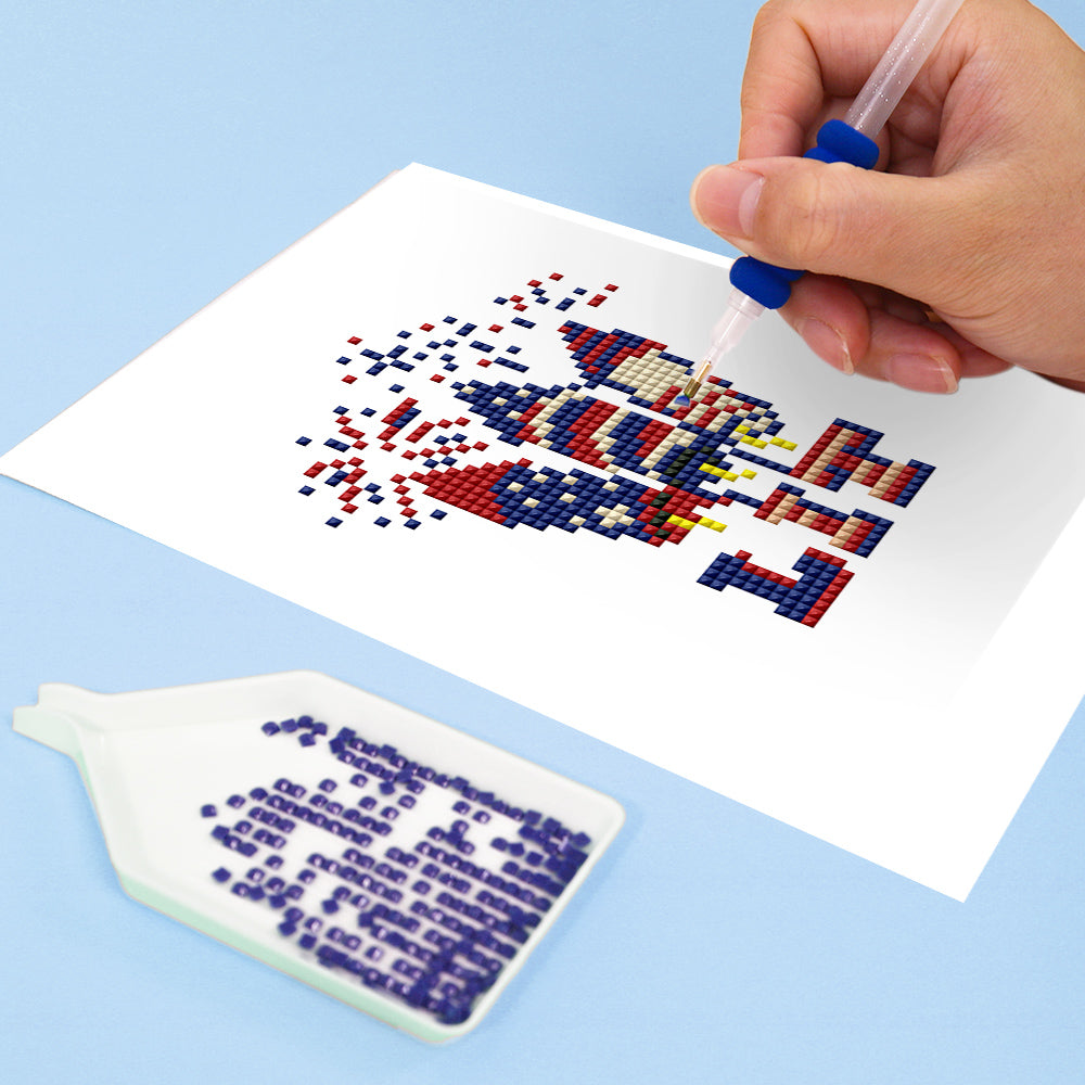 Close-up of DIY diamond painting with hand placing drills on patriotic firework design — beginner-friendly craft with clear symbols and relaxing process