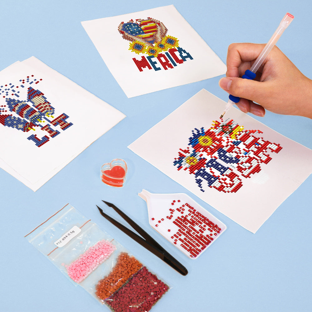 Hands placing drills on a patriotic USA heart canvas — beginner-friendly diamond painting kit for mindful and festive DIY crafting
