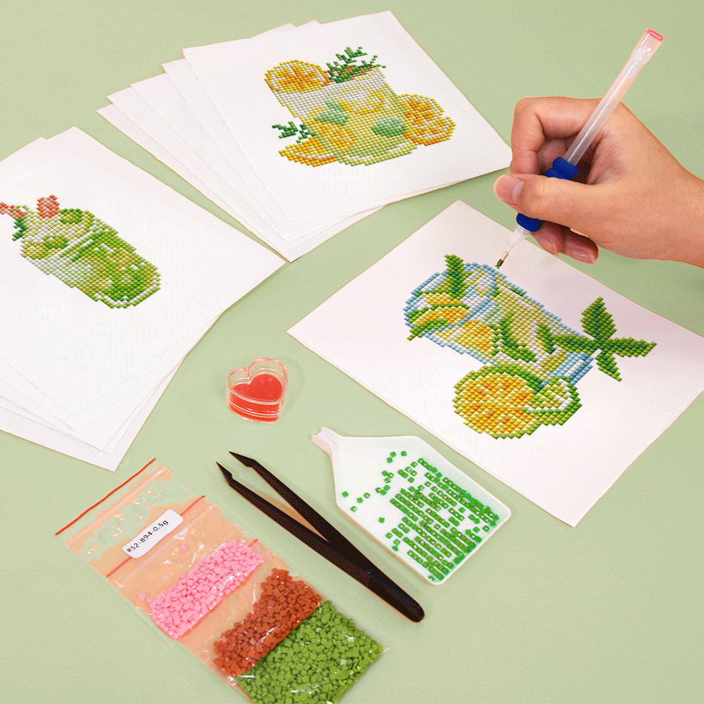 Hand placing drills on a colorful cocktail pattern canvas, showcasing the vibrant detail of this summer drink diamond painting kit.