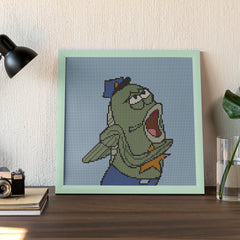 Framed ocean-themed fish character in uniform, bold desktop decor piece with a touch of comedy.