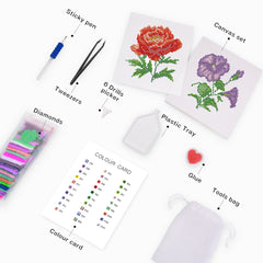 Flat lay of floral diamond painting components – includes canvas, resin drills, toolkit, and printed color guide