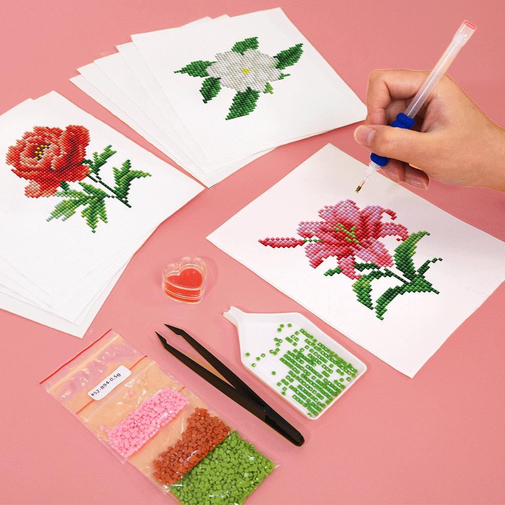 Hands working on flower diamond painting canvas with sticky pen – relaxing DIY moment for craft lovers.