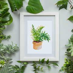 Framed green plant diamond art hung on wall – stylish minimalist decor for living room or office.