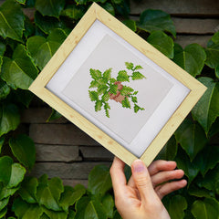 Framed plant diamond painting displayed outdoors – DIY botanical art for home or balcony decoration