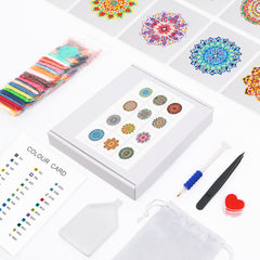 Flatlay of complete mandala diamond painting kit including tools, canvas, and resin drills