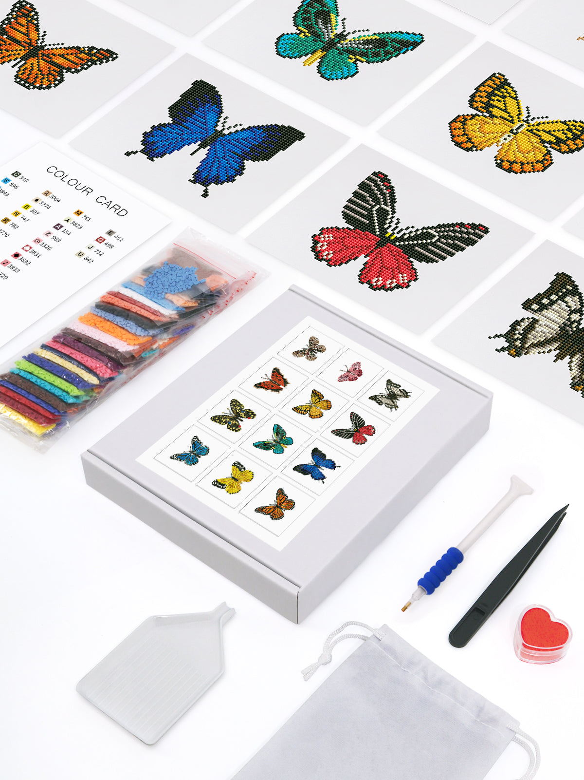 Top view of nine finished butterfly diamond art canvases from the Mini Butterfly Kingdom 2 kit, featuring vibrant pixelated butterfly designs.