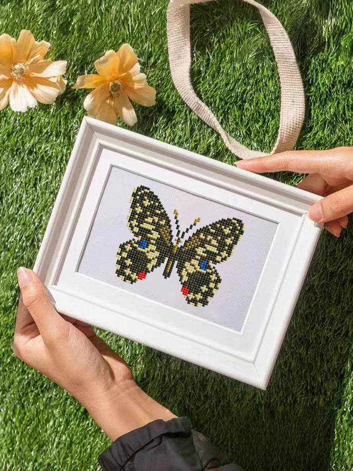 Framed green butterfly mini diamond painting displayed with natural light – handcrafted detail for home decor or gift.
