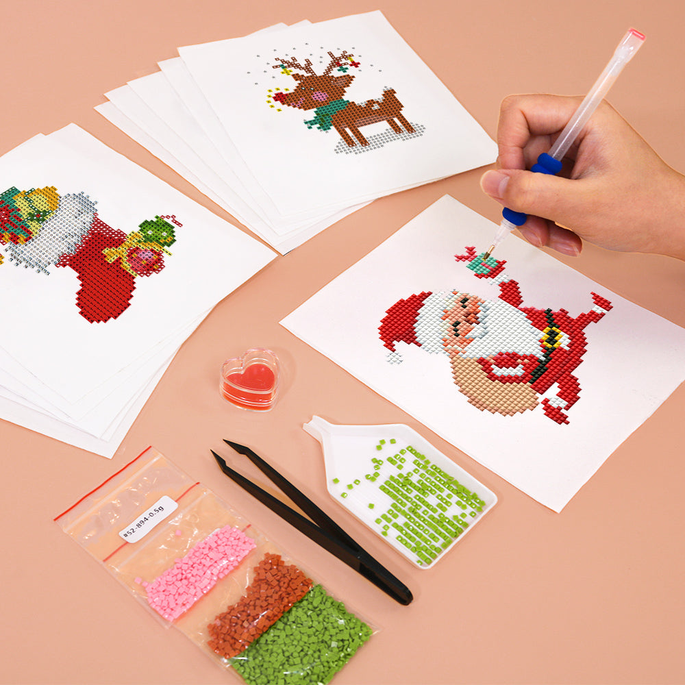 Close-up of hands working on holiday diamond ornament canvas. Great for beginners and fun Christmas crafts at home or with kids.