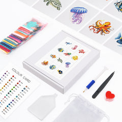 Complete Ocean Whispers kit with canvas, color chart, resin drills, tweezers, and tools for underwater diamond art.