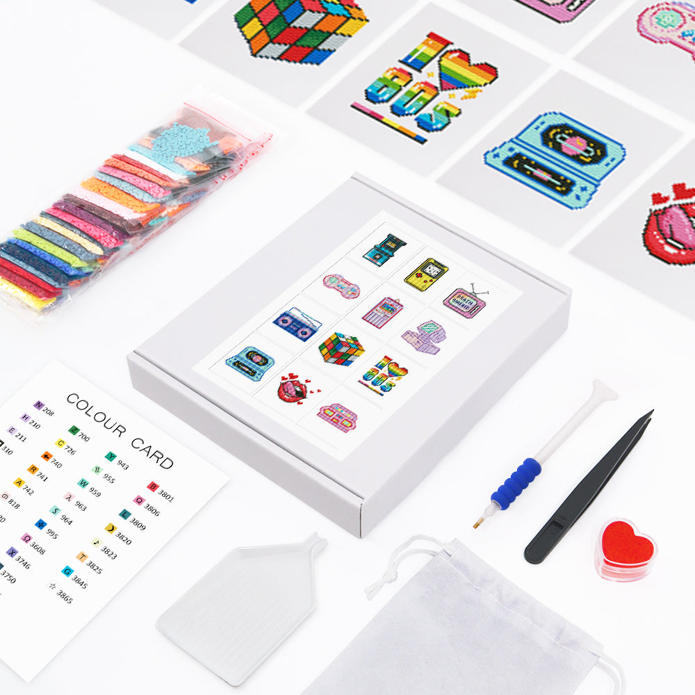 Full layout of the 80s and 90s diamond painting kit, featuring 12 retro gadgets canvases, color drills, tool bag, and accessories.