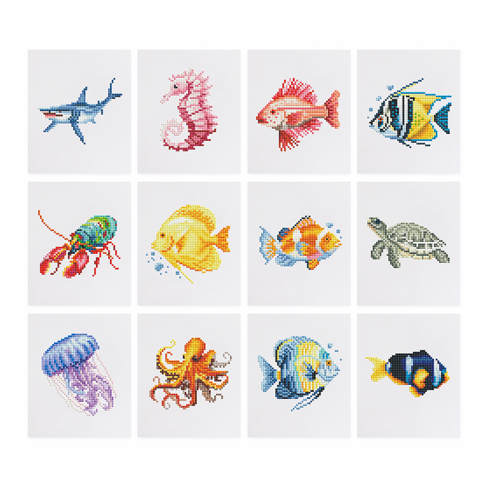 Ocean Whispers diamond painting kit with 12 ocean animal patterns including fish, sea turtle, jellyfish, and seahorse. DIY art set for sea lovers.