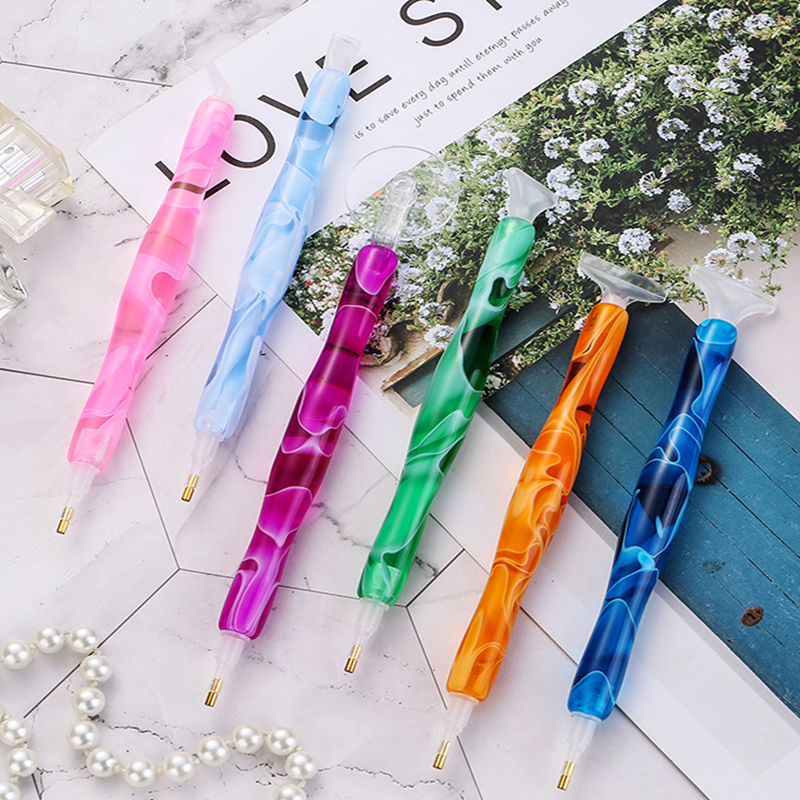 Diamond painting pens in 5 colorful resin styles with included tips. Ideal for DIY artists, hobbyists, or creative gifting.