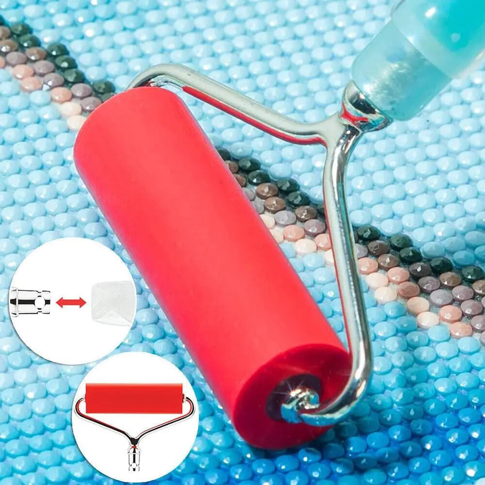 Close-up of red diamond painting roller pressing drills on canvas. Helps secure diamonds for a smooth and professional final artwork.