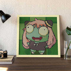 Framed Silly Zombie Girl diamond painting displayed on a wall in a cozy home setting, showcasing a playful Halloween-themed decor idea.