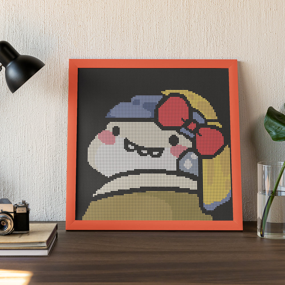 Small Funny diamond art kit with adorable monster displayed in frame on a desk, 30*30cm, beginner friendly
 and perfect for whimsical home or office decor.