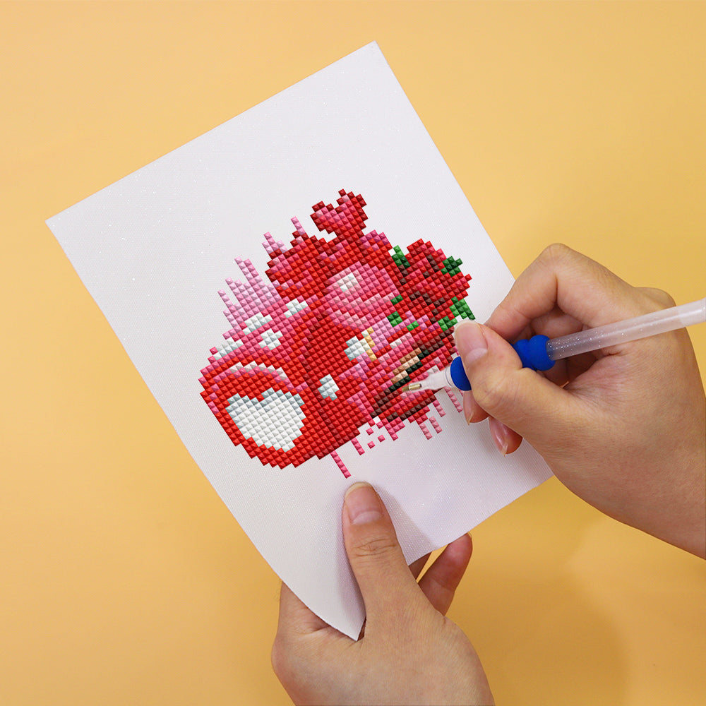 Close-up of a red floral truck canvas from the Bloom & Bite mini diamond painting kit – made with resin drills and soft printed canvas.