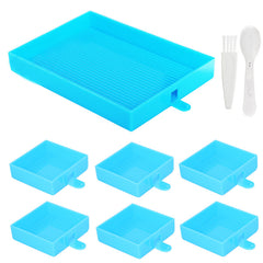 Blue diamond painting tray organizer set with 1 large tray and 6 color-sorting trays, plus spoon and brush for diamond art projects.