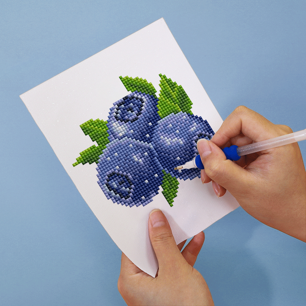 Blueberry diamond painting in progress on soft canvas, showing fine detail with 100% resin drills, perfect for fruit lovers.