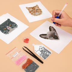 Hands applying drills to cute cat diamond painting canvas – fun and beginner-friendly DIY art kit for cat lovers