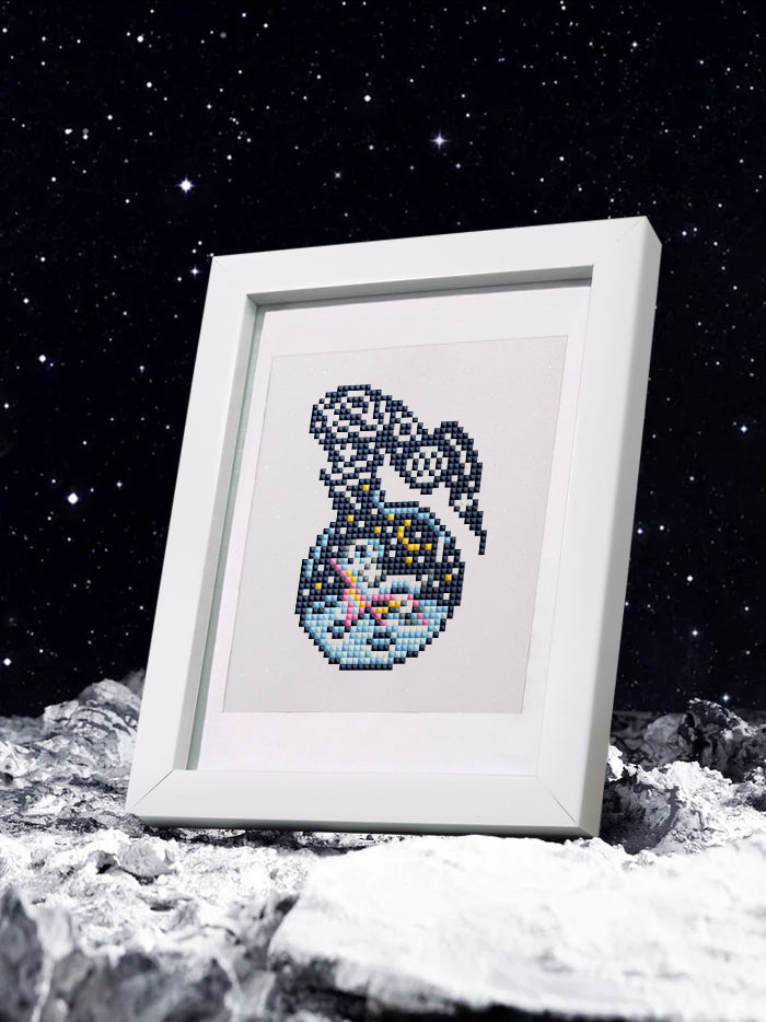 Space jellyfish design finished in diamond art and framed under stars – whimsical sci-fi decor.
