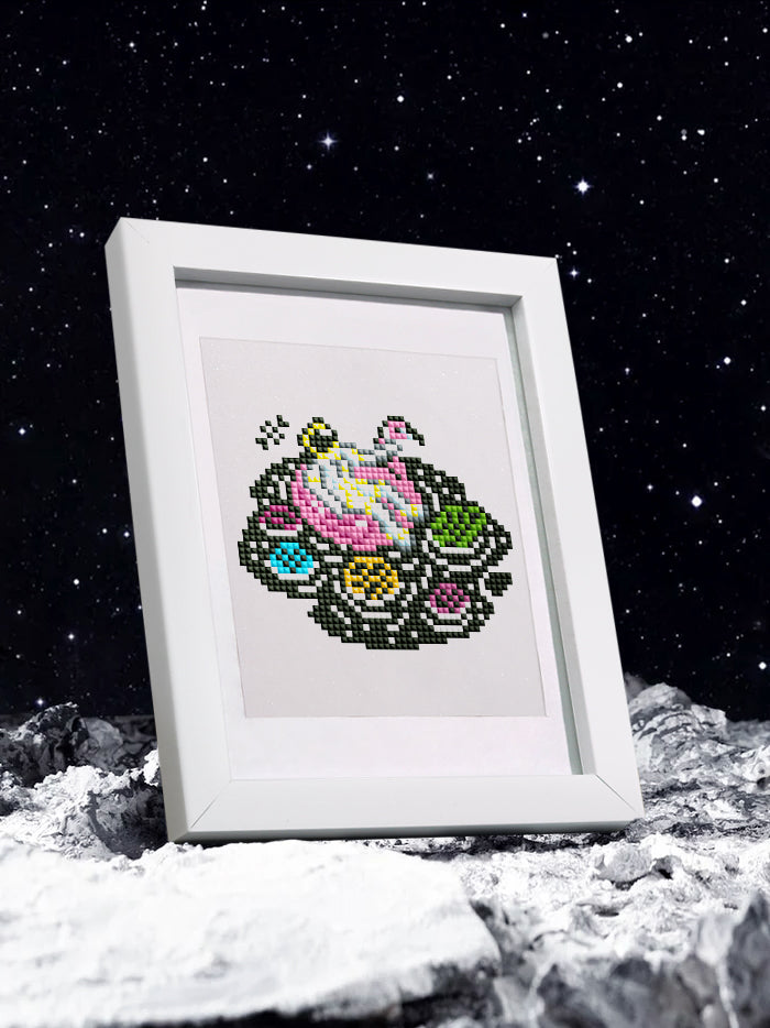 Psychedelic astronaut skull design in a white frame on clean desk – mystical and modern style.
