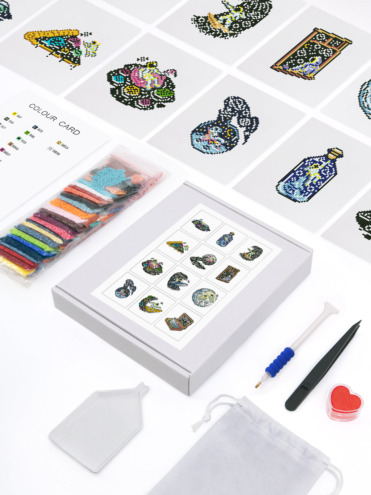 Cosmic Adventures mini diamond painting kit flat lay with all tools, drills, and galaxy art canvas cards.
