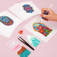 Colorful stained glass floral diamond painting canvas being cut, with toolkit shown. Ideal for beginners and relaxing creative hobbies.