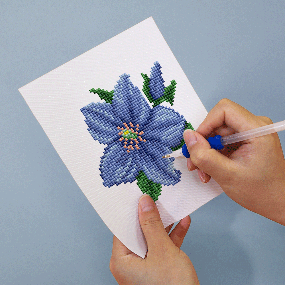 Close-up of DIY blue flower diamond painting canvas in progress – detailed resin drill placement on vibrant blue petals.