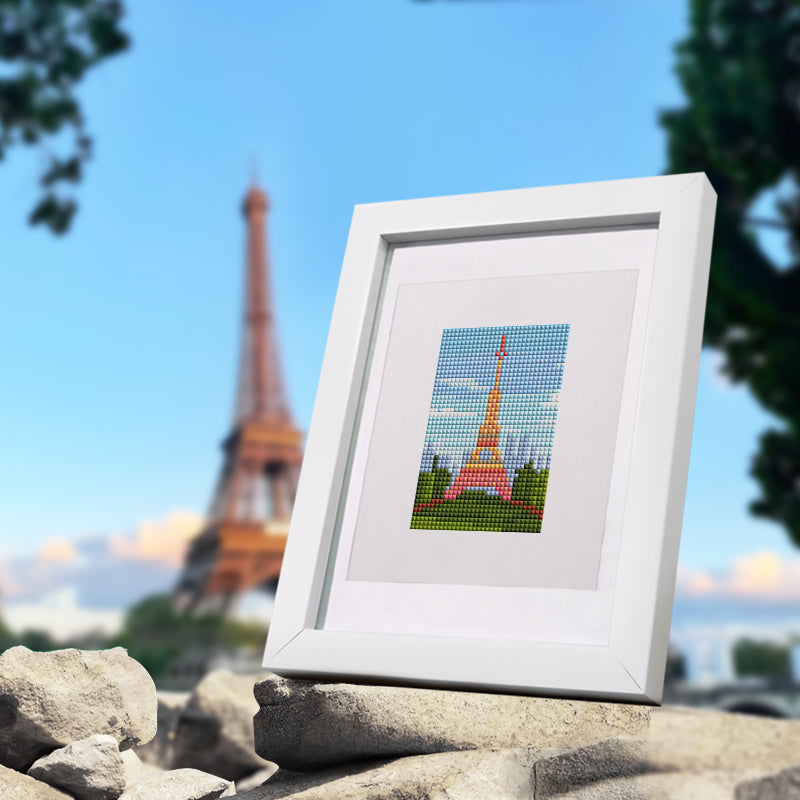 Mini diamond painting of the Eiffel Tower in Paris, perfect for beginners or travel lovers decorating a cozy space.
