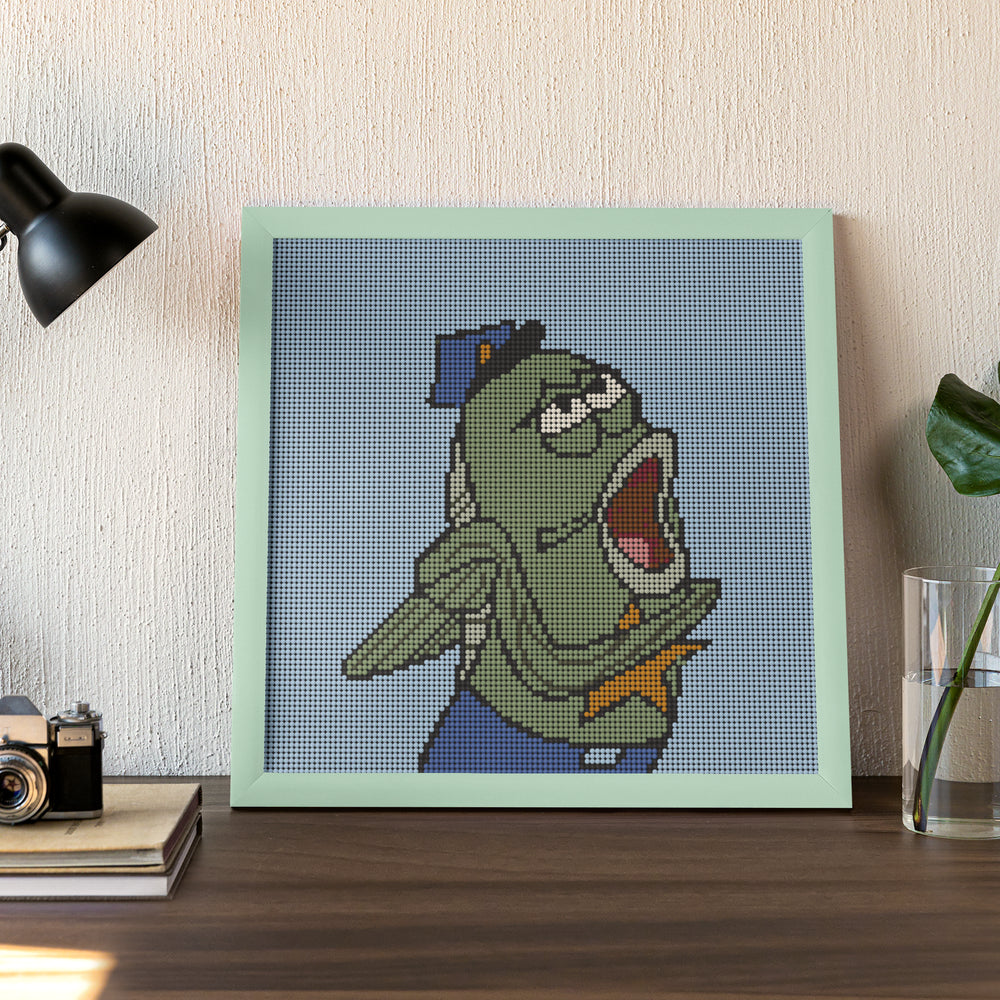 Framed ocean-themed fish character in uniform, bold desktop decor piece with a touch of comedy.