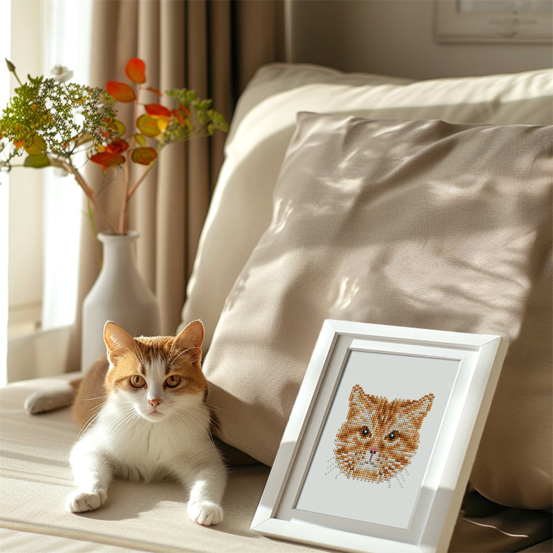 Framed black cat diamond painting held in sunlight – cozy, handmade art for cat enthusiasts