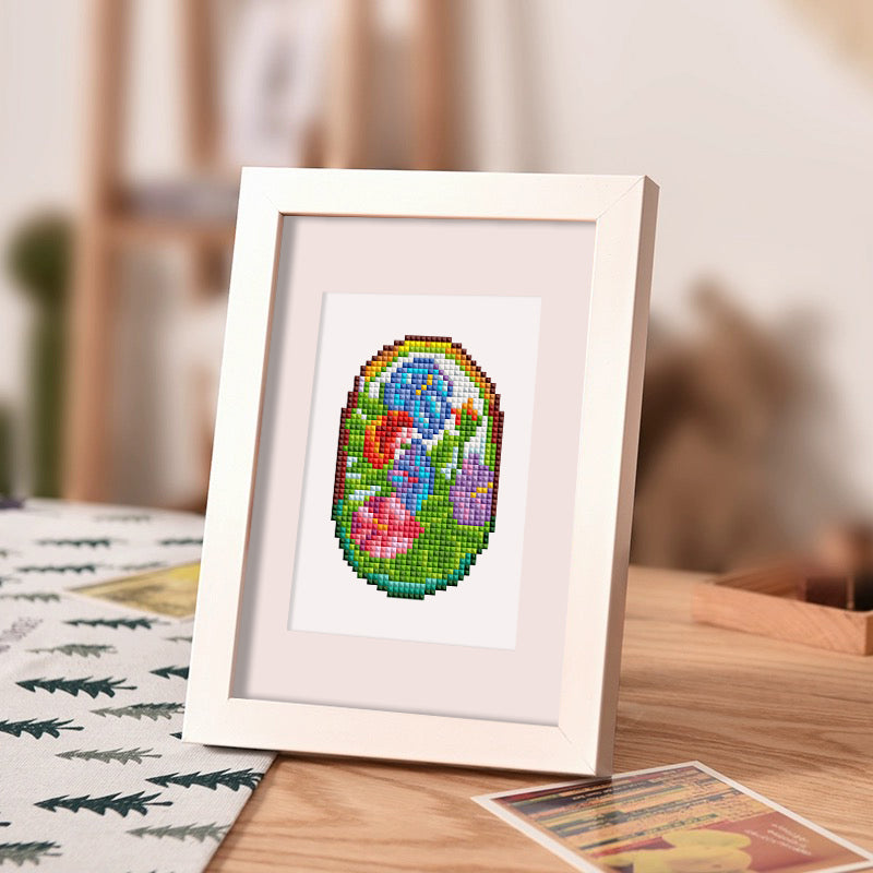 Framed oval-shaped stained glass floral diamond painting featuring vibrant tulips and irises – DIY decor for beginners, relaxing and easy to complete