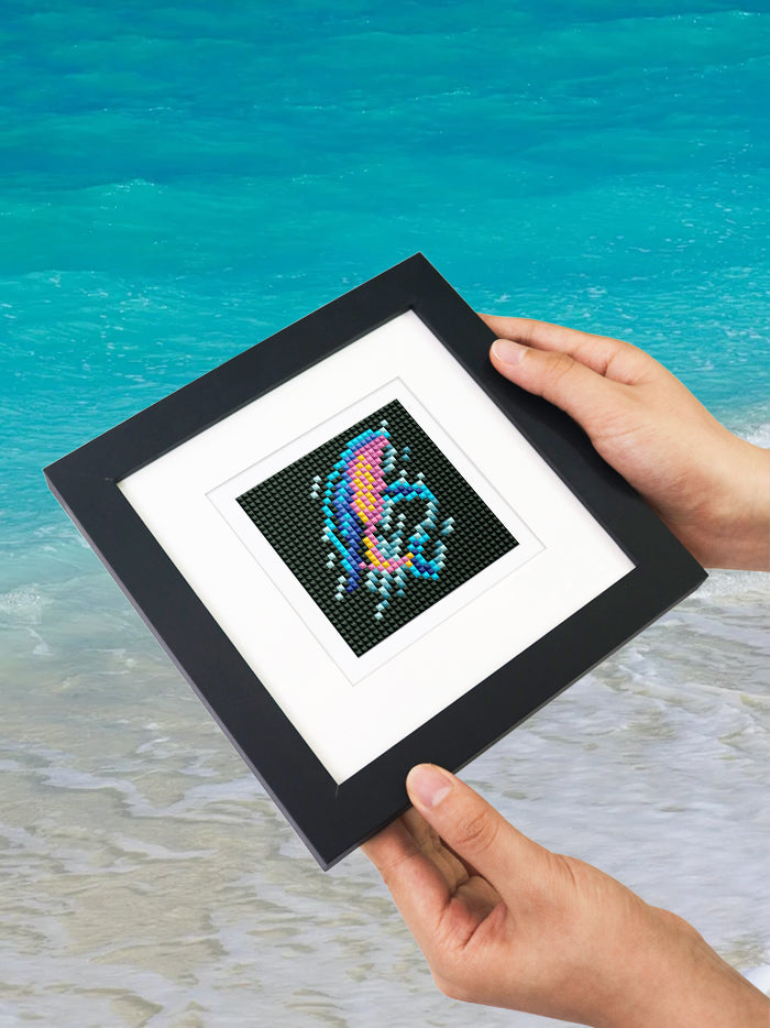Hands holding a finished futuristic animal mini diamond kit, showcasing portability and fun DIY use.
