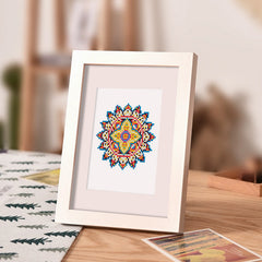Mandala diamond painting framed and placed on soft background room, showcasing finished artwork