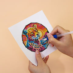 Close-up of rainbow tiger diamond painting being crafted