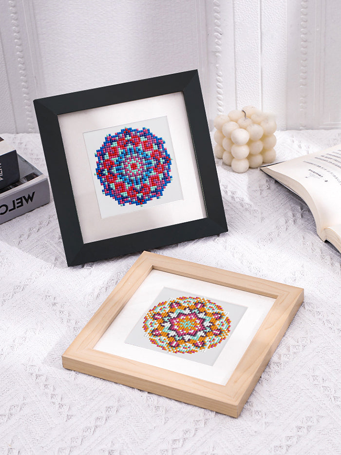 Dual framed rainbow mandala diamond paintings in black and white frames – ideal for calm bedroom spaces.
