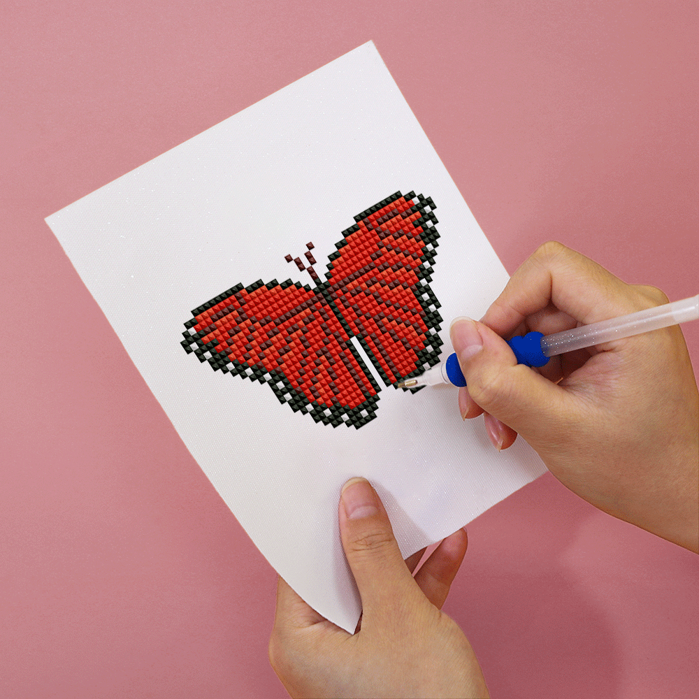 Detailed view of a red butterfly diamond painting – high-quality printed canvas with soft fabric and resin drills.