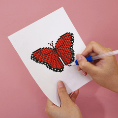 Detailed view of a red butterfly diamond painting – high-quality printed canvas with soft fabric and resin drills.