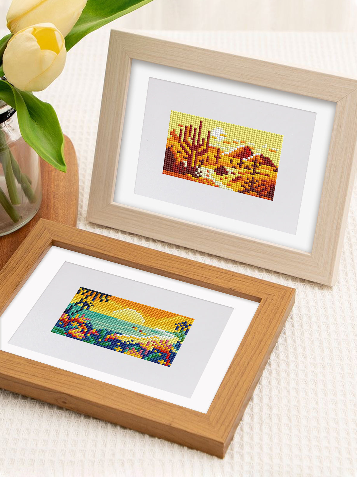 Double mini frame setup showing two different vistas – lake and fields – ready for art lovers’ shelves.

